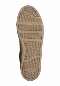 Beiger Gummi-Schuhsohle mit einem strukturierten Grip-Muster, das abwechselnd wellenförmige und lineare Designs zeigt. Eingraviertes Markenlogo sichtbar.