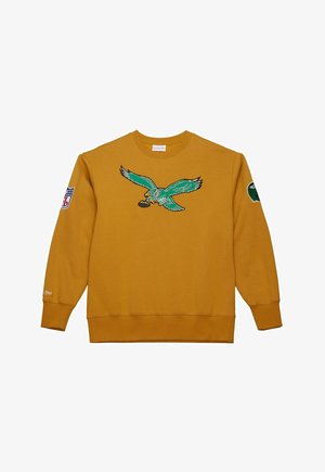 Gelbes Sweatshirt mit einem gestickten grünen Adlerdesign in der Mitte, einem Logopatch auf dem linken Ärmel und gerippten Bündchen.