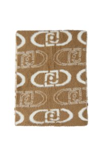 Coperta in pelliccia sintetica marrone con motivi circolari e rettangolari bianchi. Texture morbida con un aspetto shaggy, che offre calore e comfort.