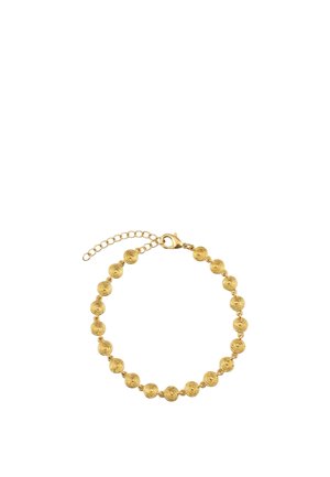 Bracelet en or avec petits charms ronds en spirale reliés entre eux et une fermeture chaîne ajustable sur fond blanc.