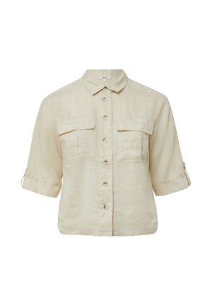 Beige linen shirt with a collared neckline, short sleeves, two chest pockets, and a front button closure. Soft texture and relaxed fit.