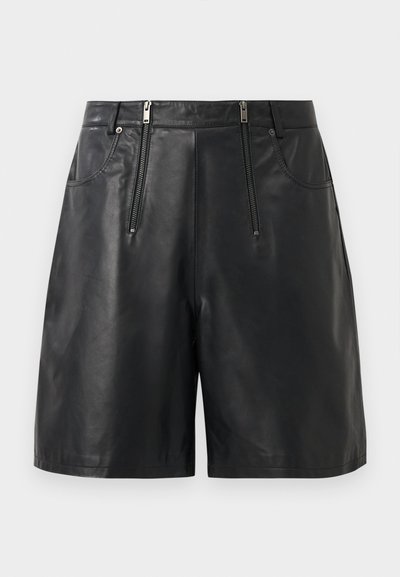 Black faux leather shorts with two front vertical zipper pockets and belt loops, displayed against a white background.