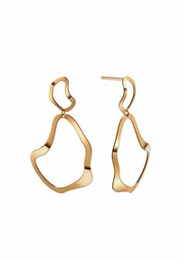 Złote kolczyki o nieregularnym, organicznym kształcie. Wzór charakteryzuje się gładkimi krzywiznami i wypolerowaną, odbijającą światło powierzchnią.