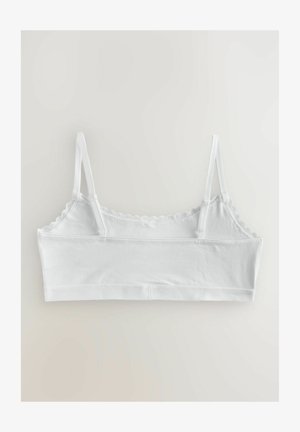 Biely bralet s nastaviteľnými ramienkami, volánikmi a hladkou bavlnenou zmesou. Disponuje jednoduchým, bezšvovým dizajnom.