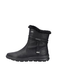 Bottines en cuir noir avec col en fausse fourrure, cordon décoratif et accents en argent. Elles disposent d'une semelle en caoutchouc flexible pour le confort.