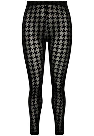 Leggings neri con un motivo a zig-zag. Il materiale appare elasticizzato e testurizzato, con una vita elastica per una vestibilità sicura.