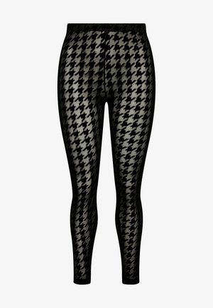 Leggings noirs avec un motif pied-de-poule. Le matériau semble extensible et texturé, avec une taille élastique pour un ajustement sécurisé.