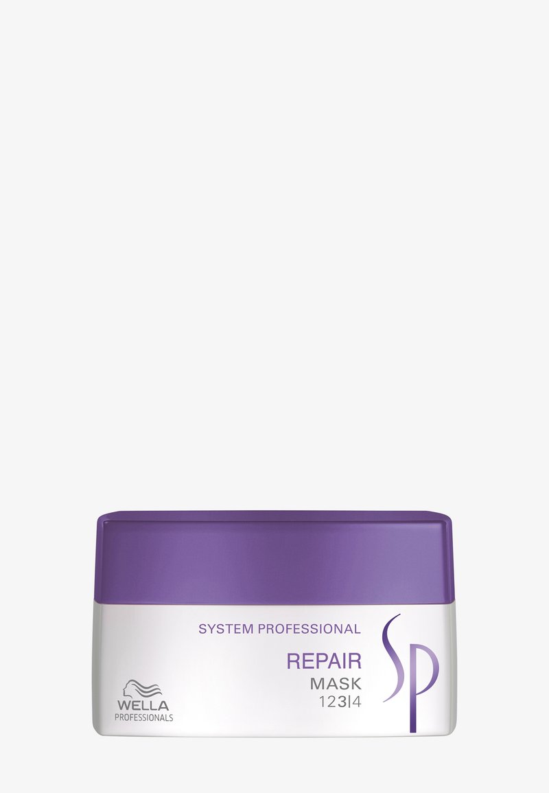 Contenant du masque réparateur Wella Professionals System Professional avec un couvercle violet et un corps blanc, étiqueté pour un traitement réparateur des cheveux.