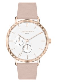 Montre ronde avec un cadran blanc, des accents en or rose et un bracelet en cuir beige. Comprend deux sous-cadrans et de fines aiguilles.
