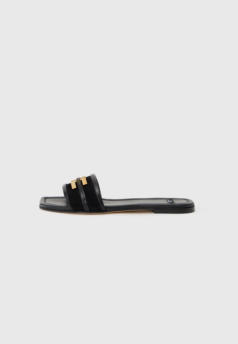 Black slide sandal featuring two horizontal bands and a gold accent. Made of smooth leather with a flat, rectangular sole.