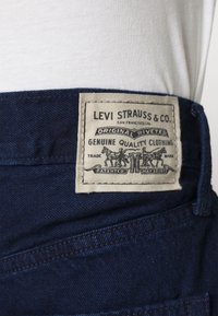 Levi's® HIGH LOOSE - Calças de ganga de perna direita - indigo charm
