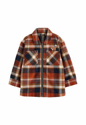 Chemise à manches longues pour enfants avec fermeture éclair, motif à carreaux orange, marine et beige, et un petit chien brodé sur la poche poitrine gauche.