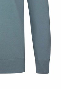 Hellblauer Pullover mit geripptem Textur. Verfügt über lange Ärmel und einen abgerundeten Saum. Hergestellt aus einem weichen, dehnbaren Material.