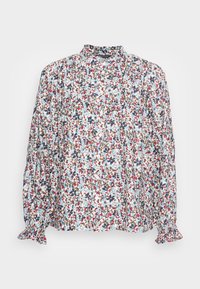 Blusa floral em tecido leve, com um padrão multicolorido com realces em azul, vermelho e castanho. Punhos franzidos e um design de gola alta.