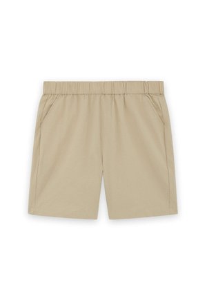 Bež hlače z elastičnim pasom in stranskimi žepi, zasnovane za priložnostno nošenje, prikazane na ravni površini na belem ozadju.