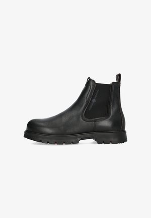 Zwarte leren Chelsea-boots met elastische zijkanten, ronde neus en robuuste rubberen zool met structuur voor grip.