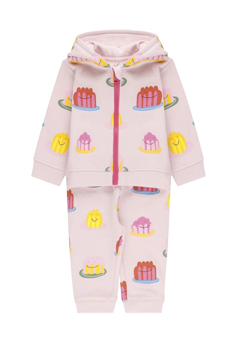 Set di felpa e pantaloni rosa chiaro realizzato in morbido tessuto, con motivi colorati di dessert e una cerniera frontale con un accento rosa.