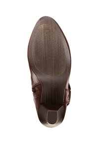 Suela de zapato de cuero marrón con una superficie lisa, patrón de agarre texturizado y ligera curvatura hacia arriba en la puntera. Presenta un tacón redondeado.