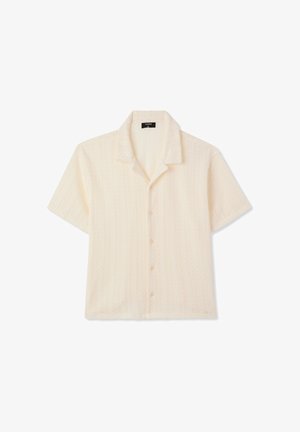 Camicia a maniche corte con bottoni, in tessuto crema chiaro, dalla texture leggermente zigrinata con motivo a zigzag discreto e colletto classico.