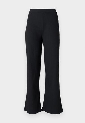 Black, textured flared pants with a fitted waistband. The fabric features subtle ribbing, flaring out at the hem for a relaxed fit.