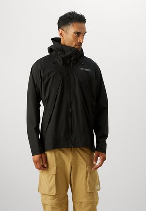Black waterproof jacket with a zip closure, adjustable hood, and front pockets. Features a lightweight design and textured fabric.