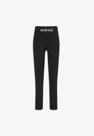 Schwarze Leggings aus dehnbarem Material, mit einem breiten Bund mit "CALVIN KLEIN" Logo, schmaler Passform und knöchellangem Design.