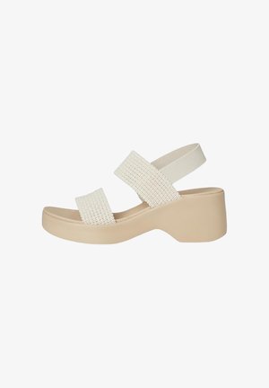 Sandalo platform beige con due ampi cinturini intrecciati e cinturino elastico posteriore su tacco a blocco.