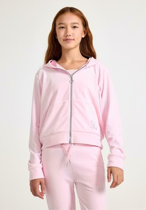 Lyserød zip-hoodie i blødt stof med hætte, frontlommer og elastiske manchetter. Sammen med matchende lyserøde joggers med snøre.