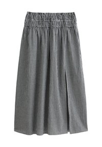 Black and white gingham-patterned skirt with a gathered waist, featuring a front slit and lightweight fabric for comfort.
