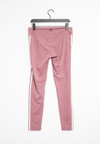 Rosa träningsleggar med ett stretchigt material, hög midja och vita sidosträck. Adidas-logotyp på bakre midjan.