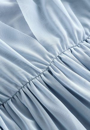 Light blue mesh fabric with a gathered texture, featuring delicate pleats along the seams, creating a flowy design.
