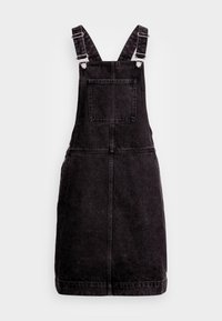 Black denim overall dress with adjustable shoulder straps, front pocket, and straight cut. Features stitching details for structure.