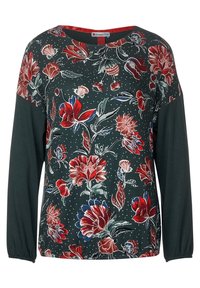 Dark green long-sleeve top with floral print in red and blue, featuring a round neckline and gathered sleeves. Soft fabric with textured details.