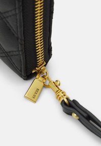 Guess GIULLY CHEQUE ORGANIZER - Lompakko - black