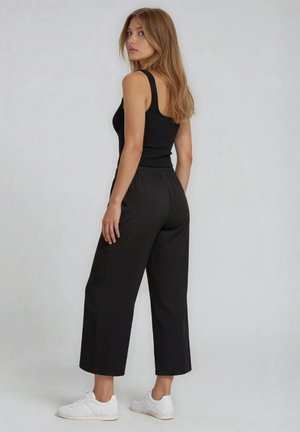Freddy, CROPPED ATHLETIC TROUSERS WITH WIDE LEG AND RHINESTONES - BLACK - Jogginghose - black