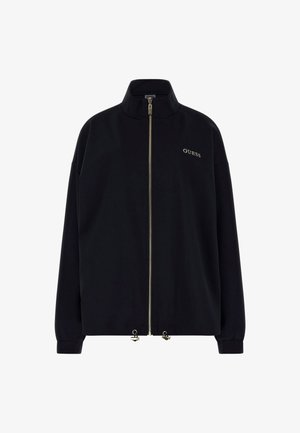 Fekete zipzáros dzseki magas gallérral. Arany cipzárral és elöl arany hímzéssel ellátott "GUESS" logóval rendelkezik. Laza fazon, passzos ujjak.