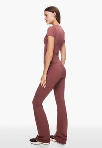 Bershka Tygbyxor - orange