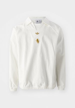 Witte pullover met een kraag, voorzien van een v-hals, geribbelde manchetten en een gouden leeuwlogo op de borst. Gemaakt van gestructureerde stof.