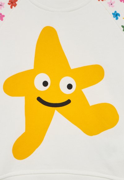 White sweatshirt featuring a large yellow star design with a face, black eyes, and a smile. The sleeves have colorful floral accents.