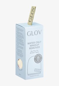 GLOV wiederverwendbare Abschminkverpackung aus hellblauem Karton, mit einem grünen Ziehband, das Informationen zur Produktanwendung und Nachhaltigkeit enthält.