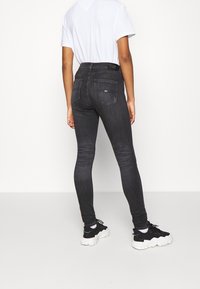 Tommy Jeans Jeans Skinny Fit - black denim