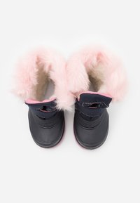 Black waterproof boots with pink faux fur trim, soft lining, and elastic bands. The design features a rounded toe and a textured outer sole.