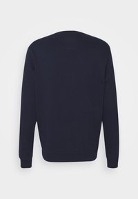 Sweat-shirt bleu marine à col rond avec manches longues et poignets et ourlet côtelés, montré de dos sur fond blanc.
