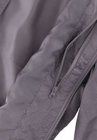 Gray jacket featuring a smooth, textured fabric with a visible zipper and interior pocket detail. Lightweight and streamlined design.