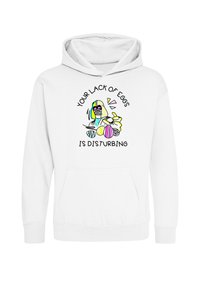 Sudadera blanca de tela suave que cuenta con un bolsillo frontal. El diseño impreso incluye gráficos coloridos y el texto: "TU FALTA DE HUEVOS ES MOLESTA."