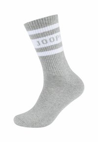 Grå bomuldsstrømpe med ribbet tekstur. Har hvide striber og "JOOP!" logo. Ankellang design med glat tå og forstærket hæl.
