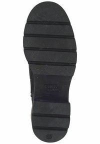 Semelle en caoutchouc noire avec une prise texturée et des rainures horizontales. Affiche l'empreinte du logo et la taille 37 à la zone des orteils.