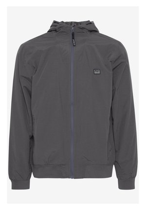 Leichte, graue Jacke mit Kapuze. Verfügt über einen blauen Frontreißverschluss, elastische Bündchen und ein kleines Logo-Patch auf der linken Brust.