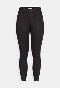 Jeans skinny de tiro alto en negro, con botón y cremallera frontales, presillas para cinturón y diseño de cinco bolsillos, mostrados sobre un fondo blanco.