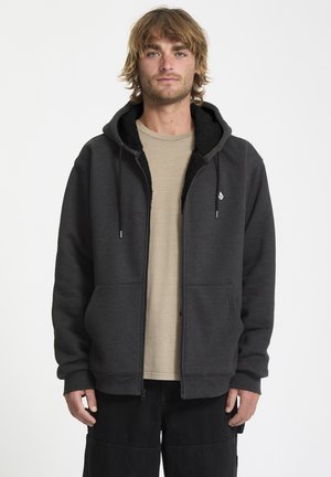 Grå zip-up hættejakke med sort fleecefor, to frontlommer, justerbar snøre i hætten og lille logo på venstre bryst.